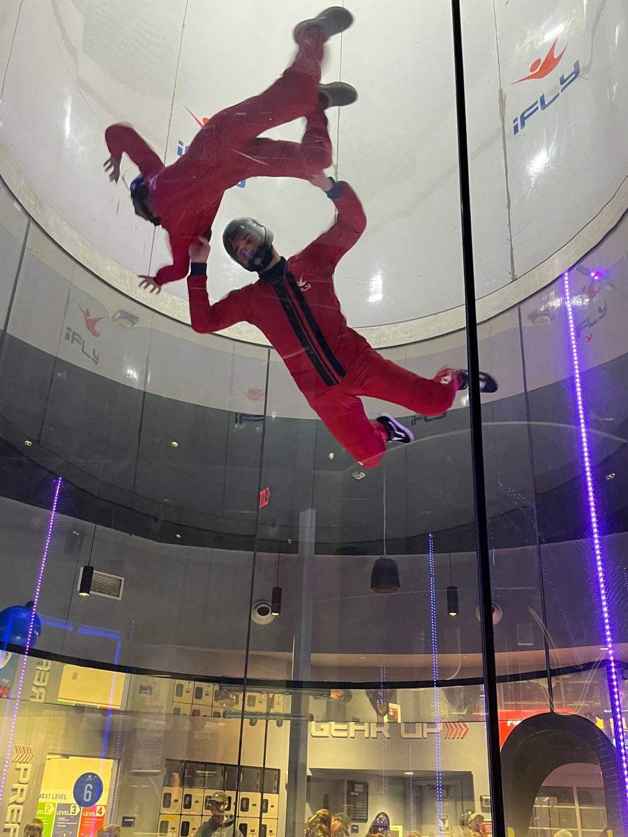 Two Brave Friends flying together in an indoor skydiving tunnel